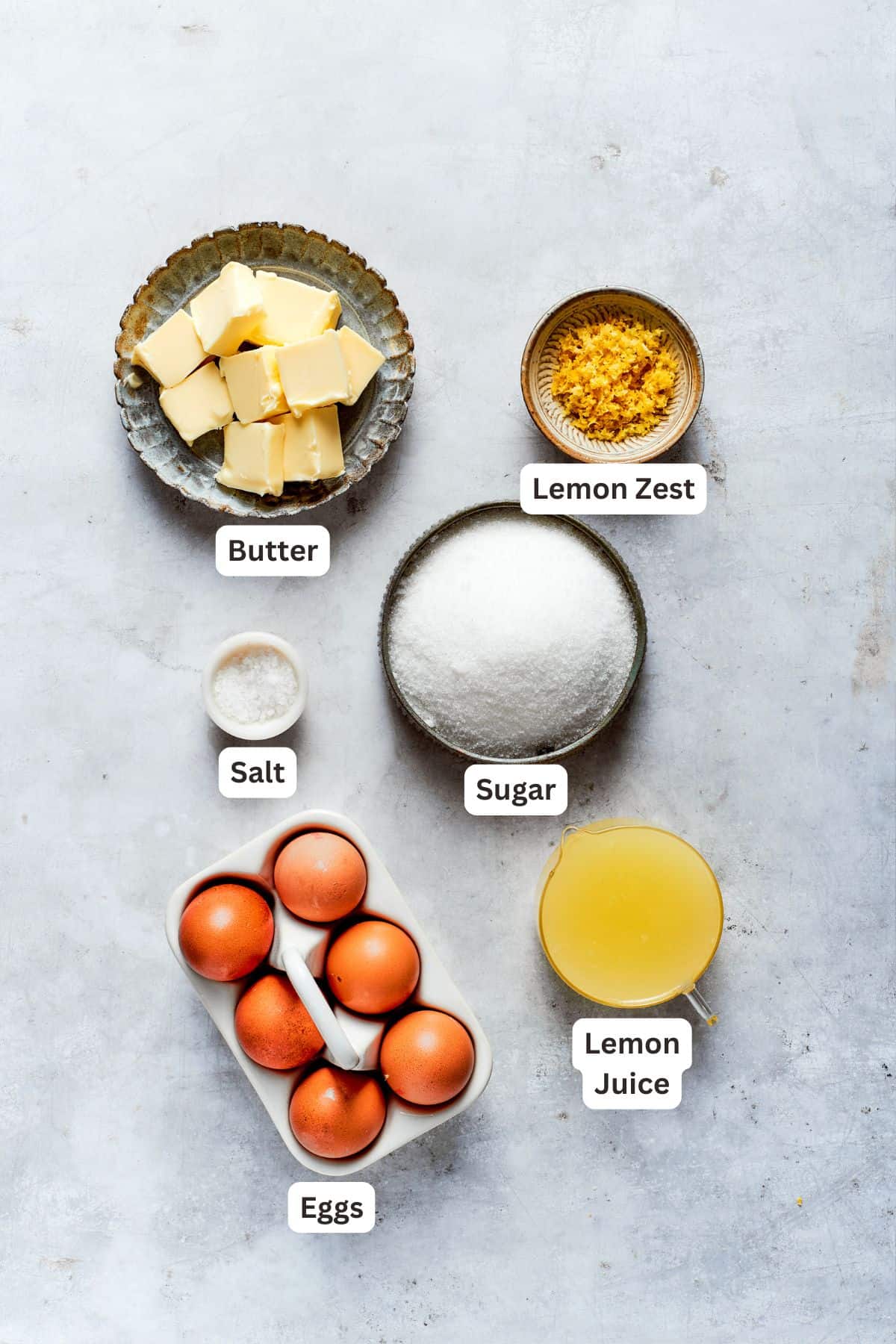 Lemon curd ingredients: butter, eggs, sugar,, lemon juice, lemon zest, salt.