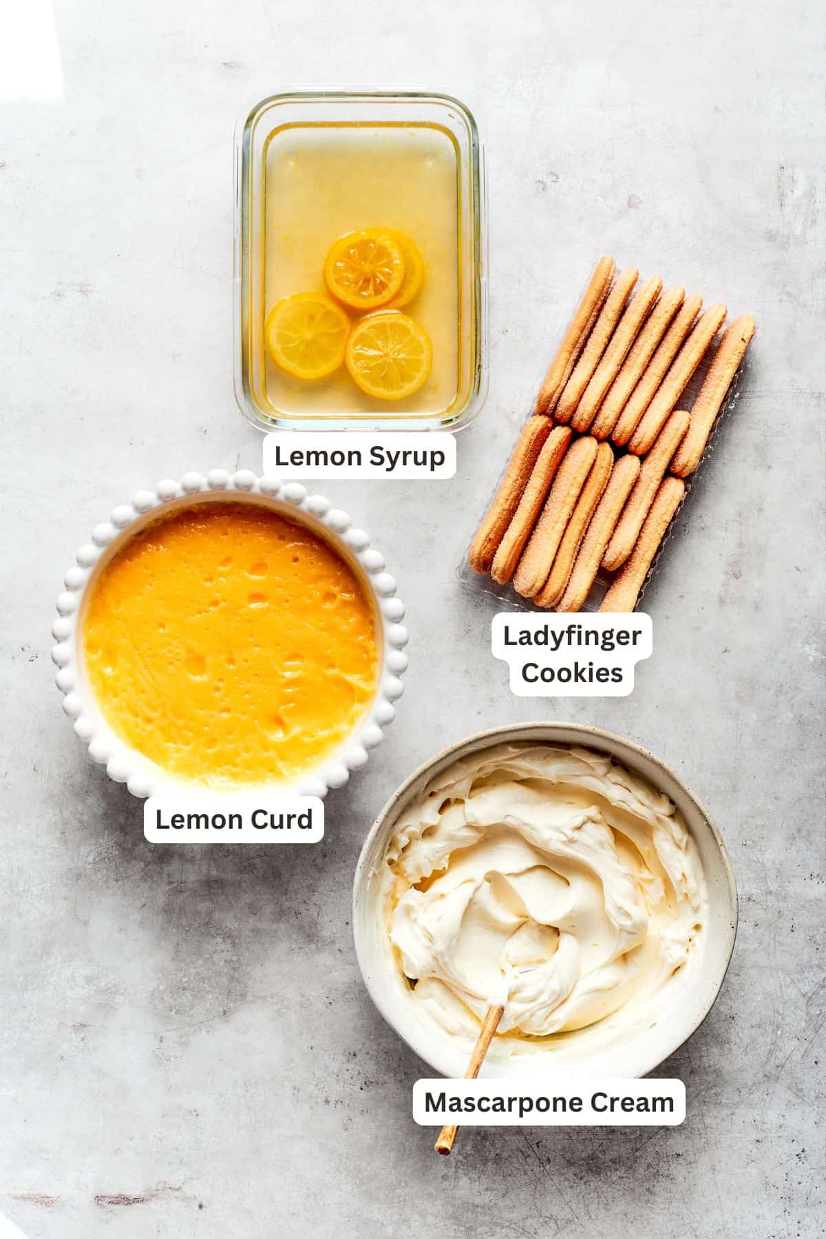 Lemon tiramisu ingredients: ladyfinger cookies, lemon curd, filling, lemon syrup.