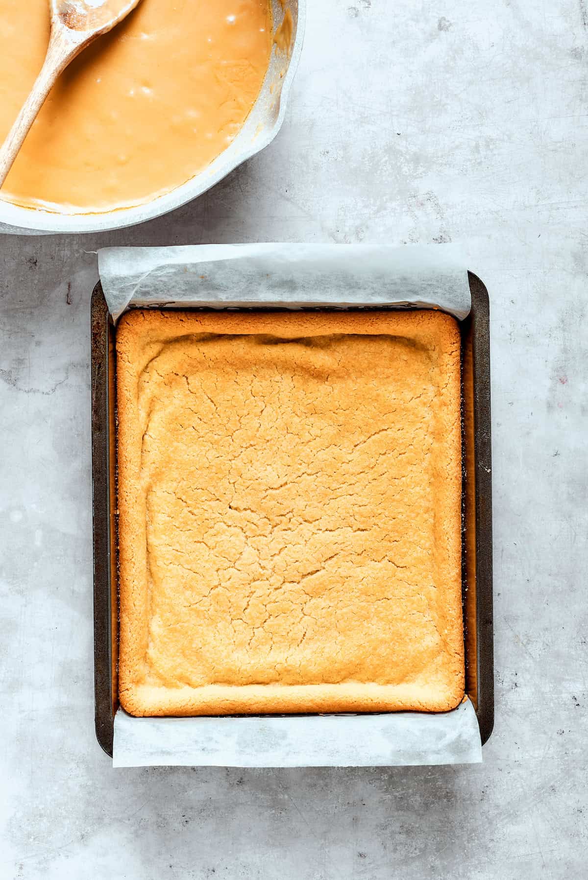 Baked shortbread cools in a pan.