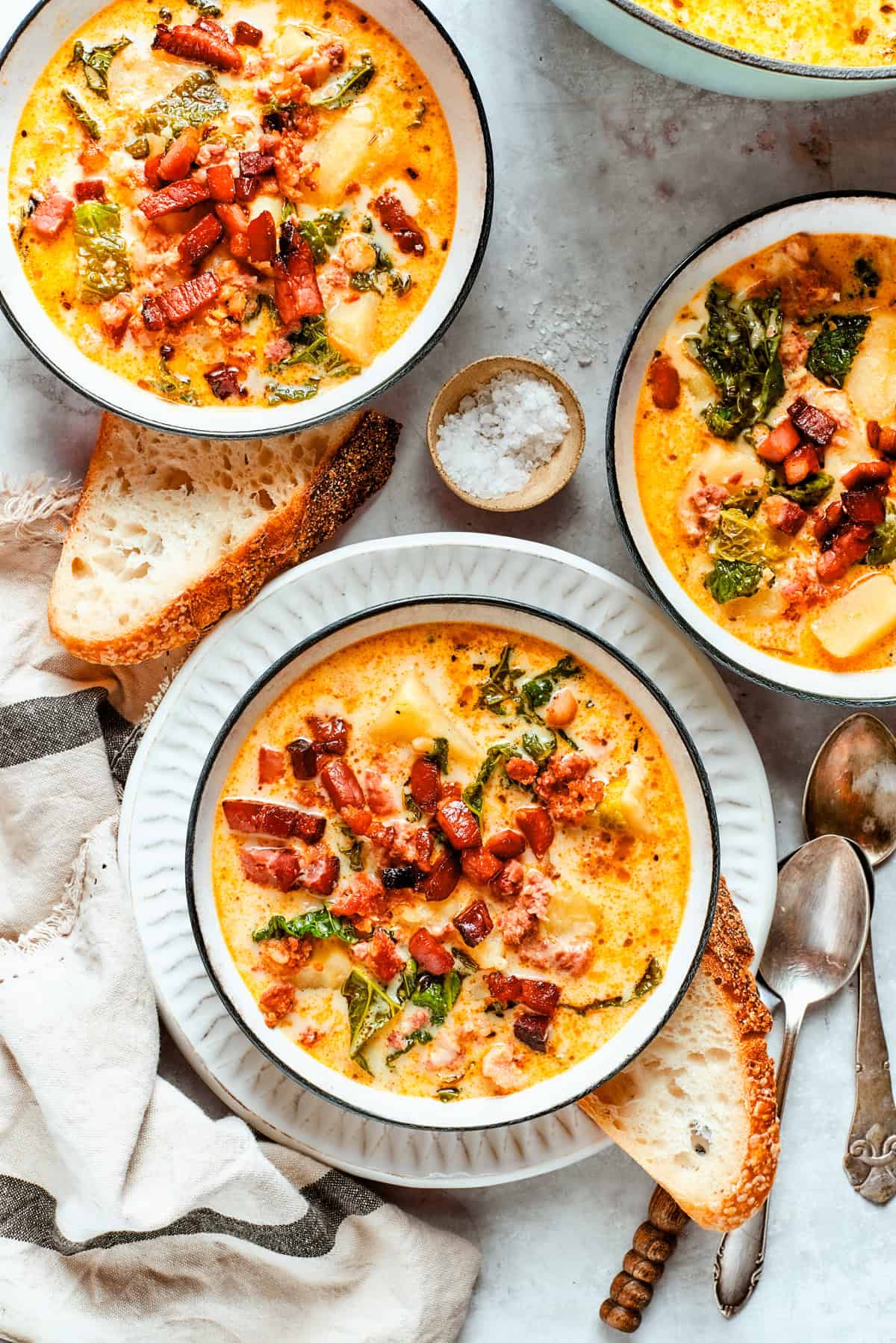 Zuppa Toscana served in three bowls.