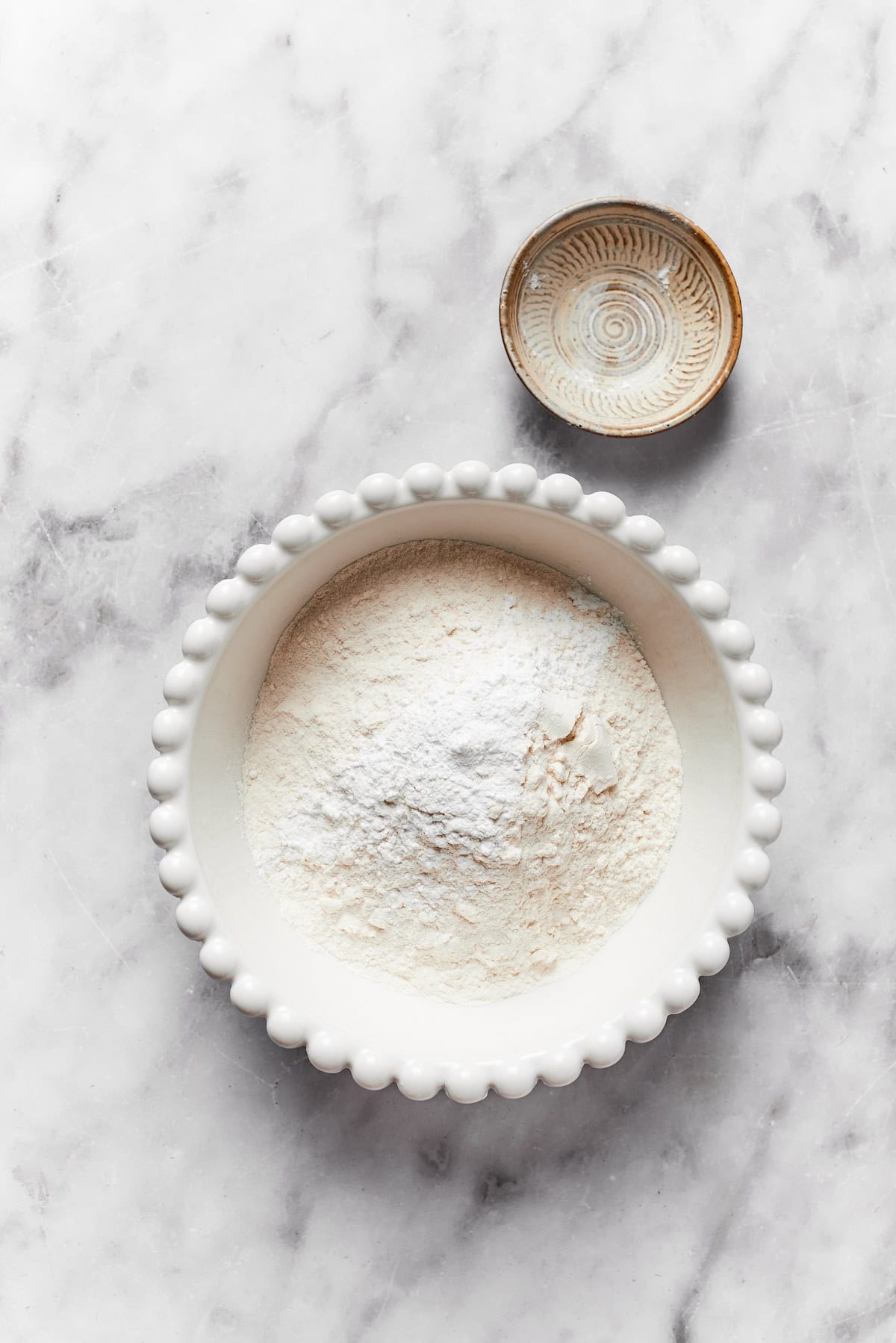 The dry mix for anginetti cookies in a bowl.