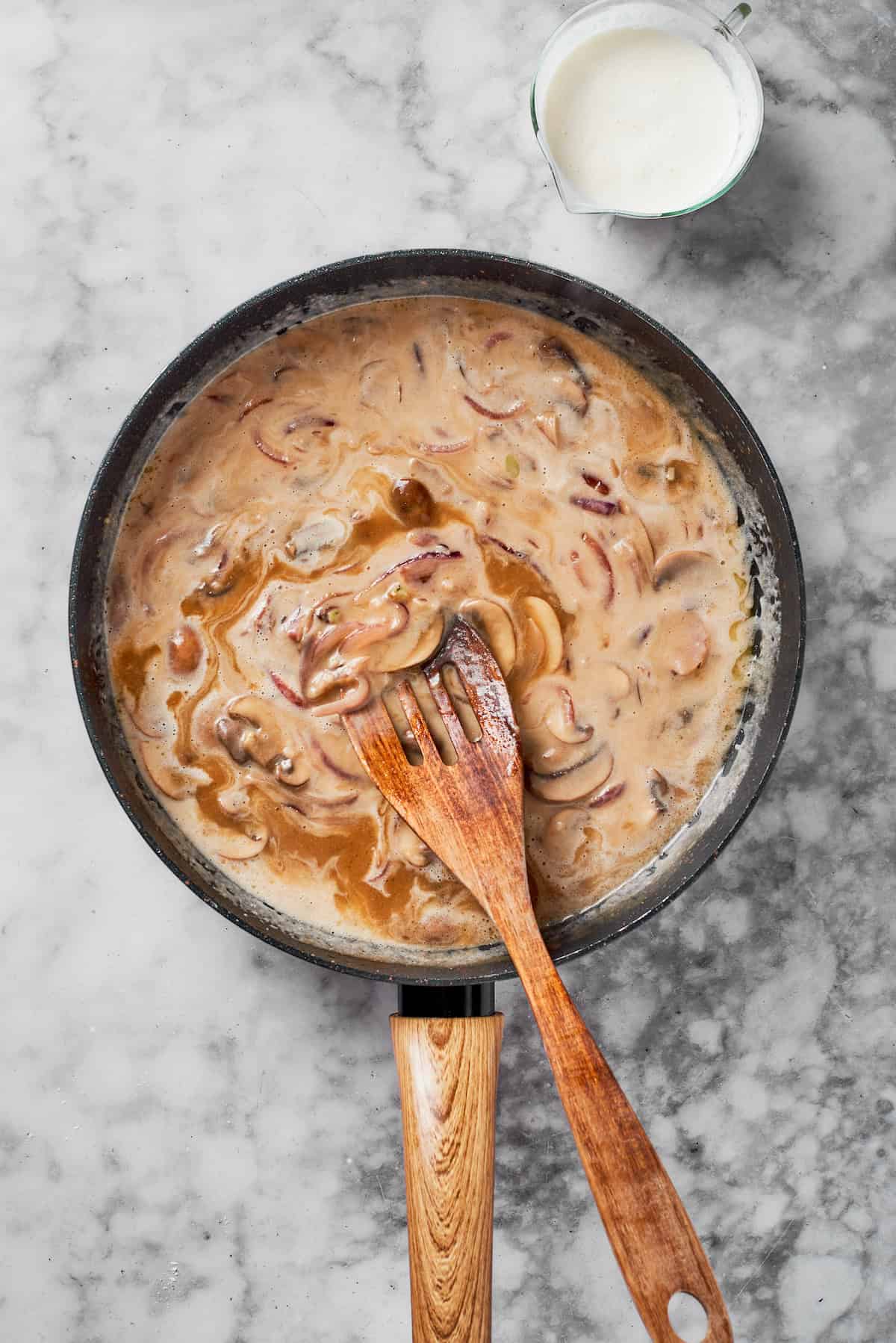 Making sauce in the skillet.