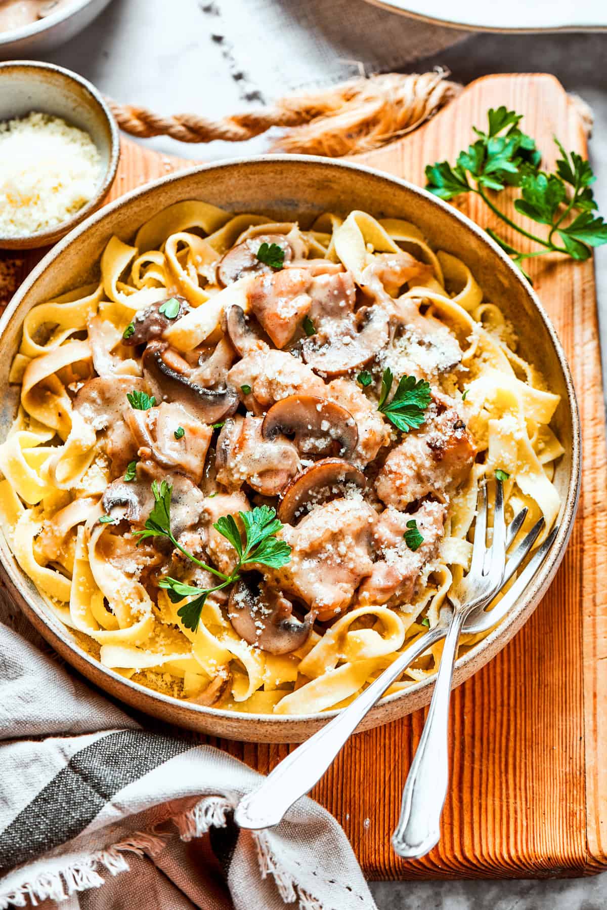 Chicken fettuccine on a cutting board.