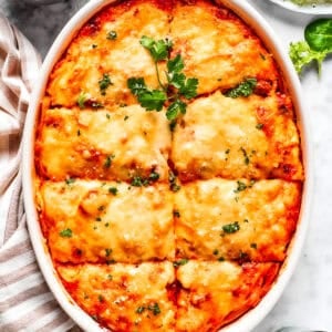 Overhead image of baked million dollar spaghetti in a casserole dish.