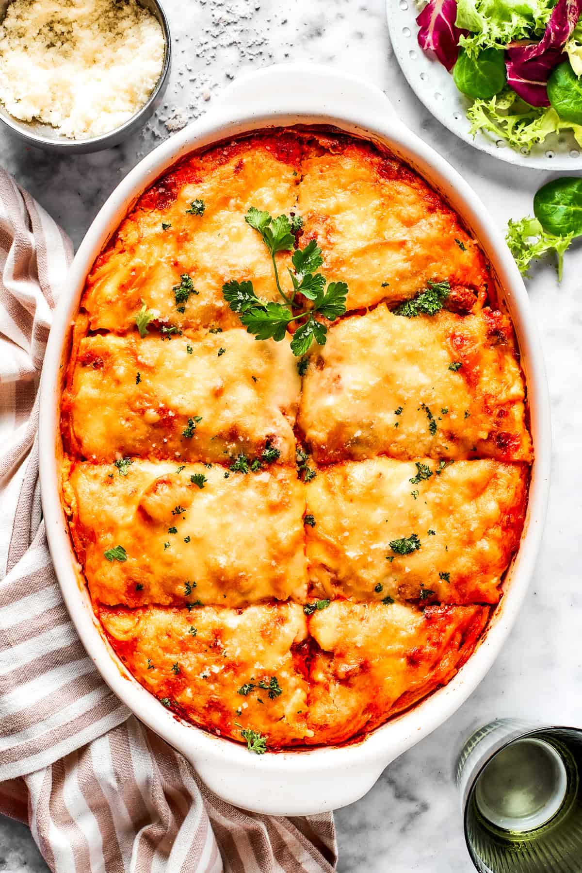 Overhead image of baked million dollar spaghetti in a casserole dish.