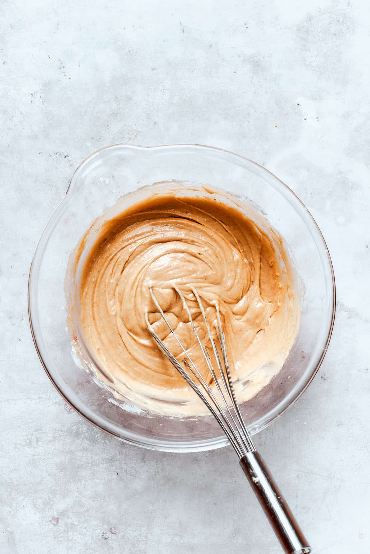 A bowl of apple cider donuts is whisked.