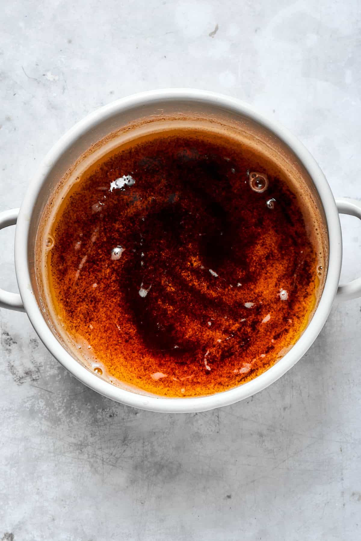 A pot of dark brown browned butter.