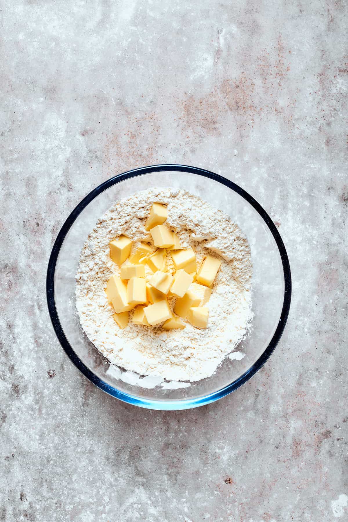 Dry ingredients and butter in a bowl.