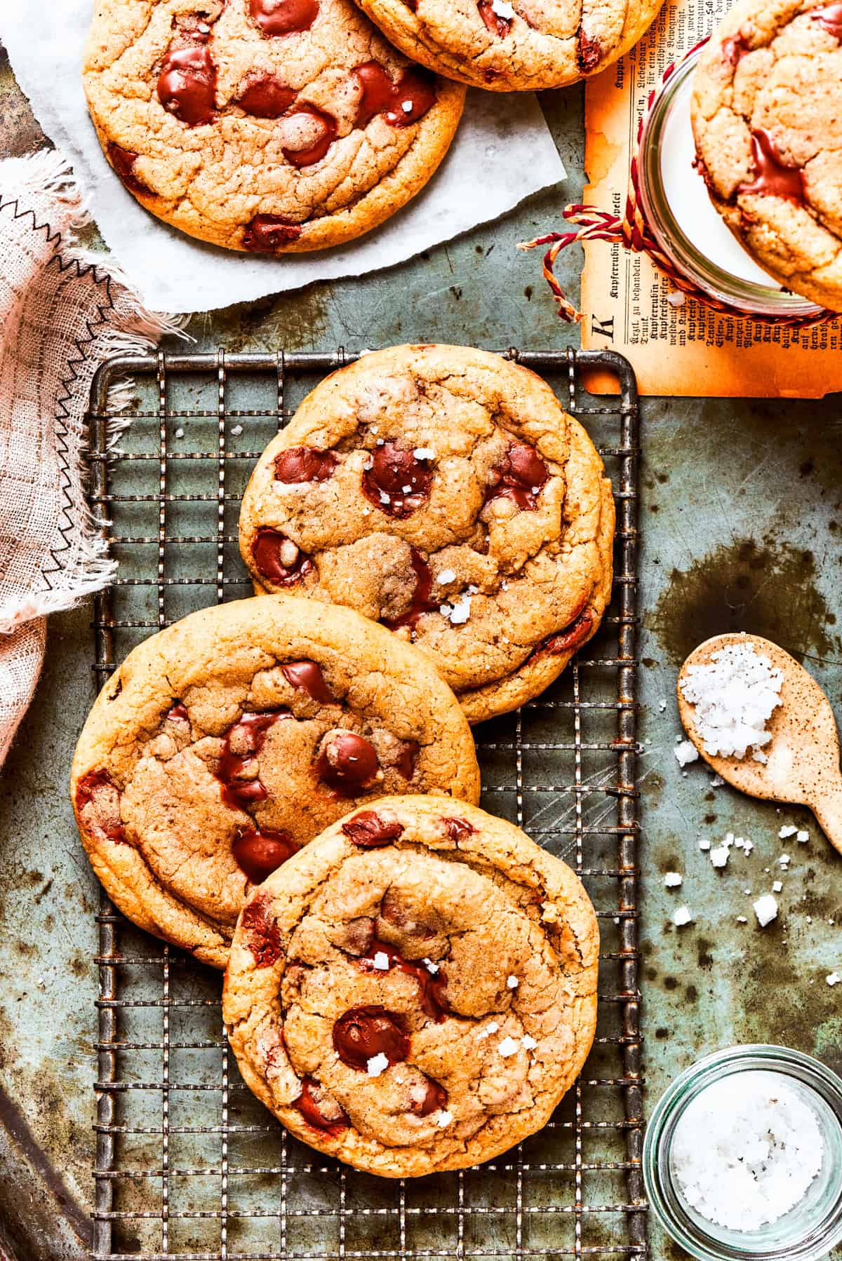 Three Brown Butter Chocolate Chip Cookies on a cooling rack.