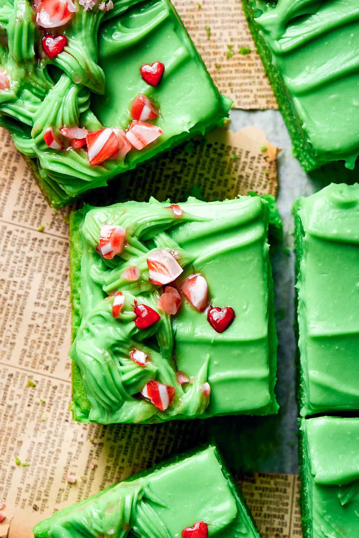 Crushed candy tops slices of grinch cake.