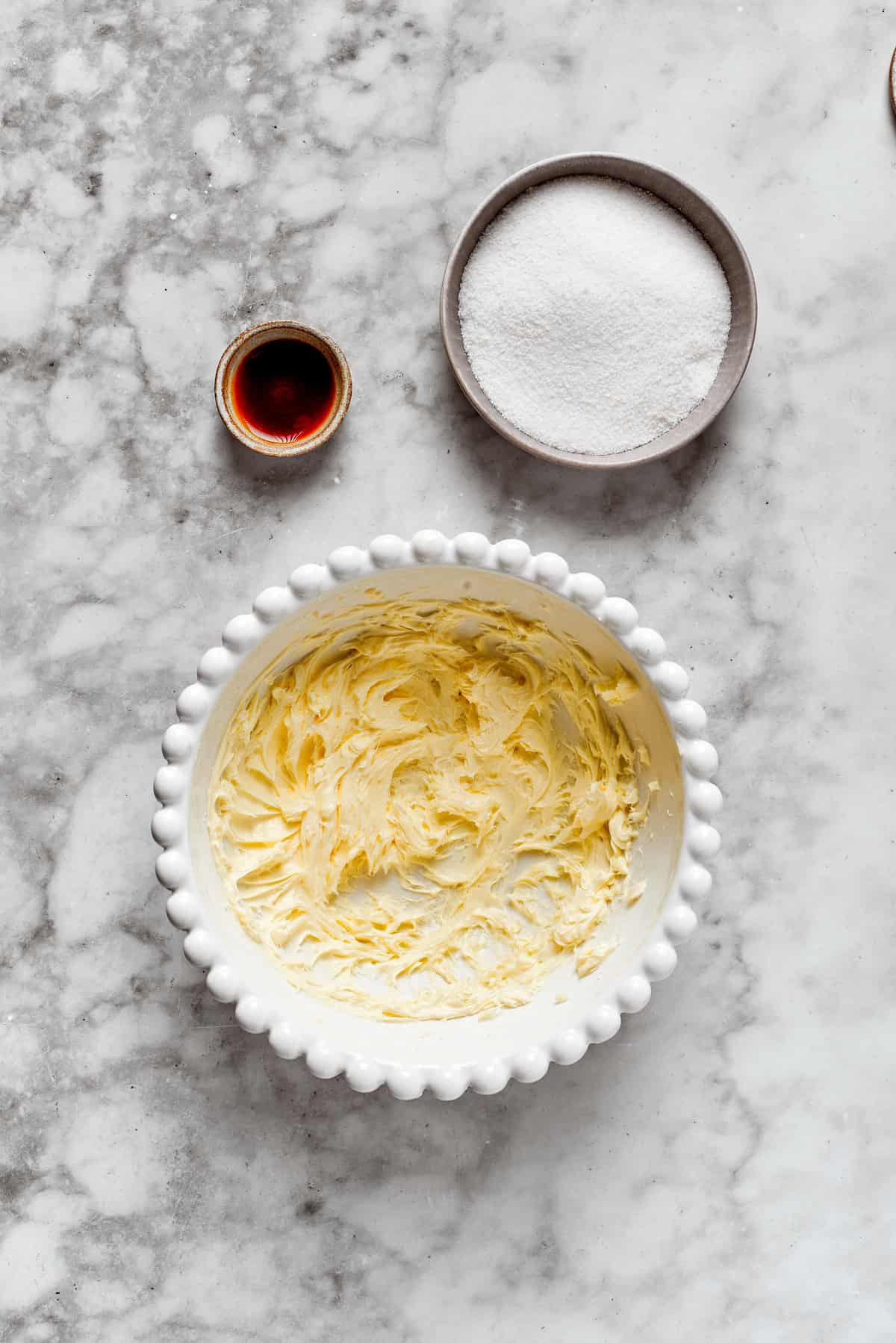 Butter and sugar creamed in a bowl.