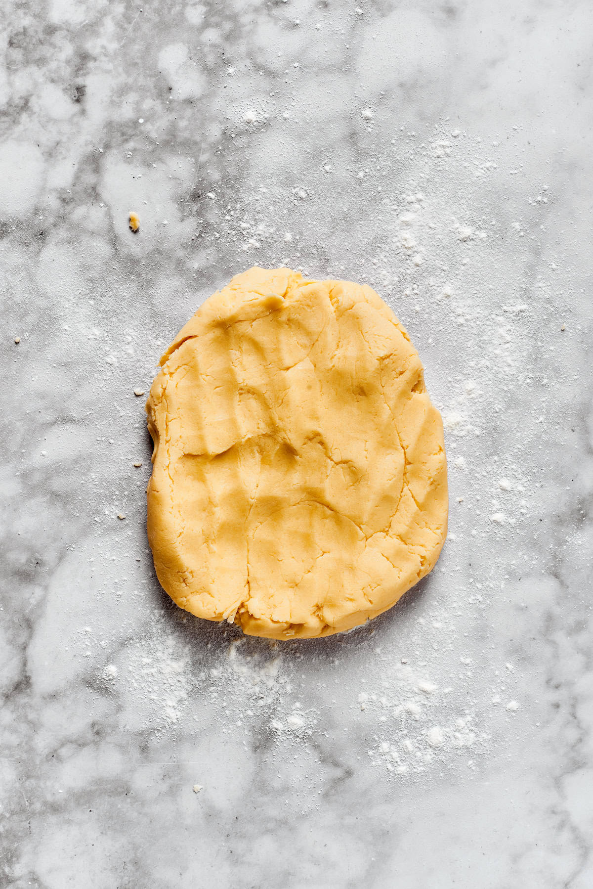 Sugar cookie dough on a counter.