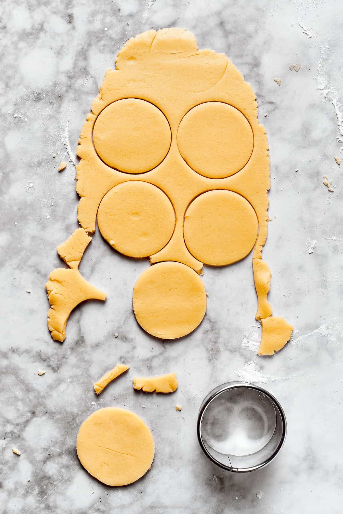 Sugar cookie dough cut into rounds.