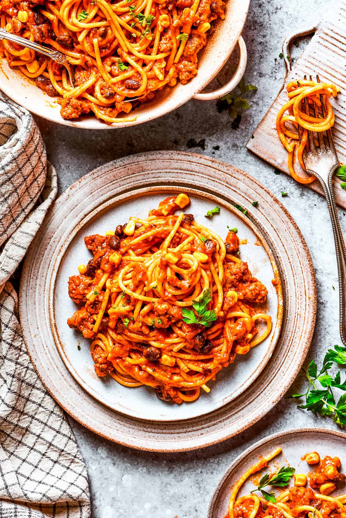 Mexican spaghetti served on dinner plates.