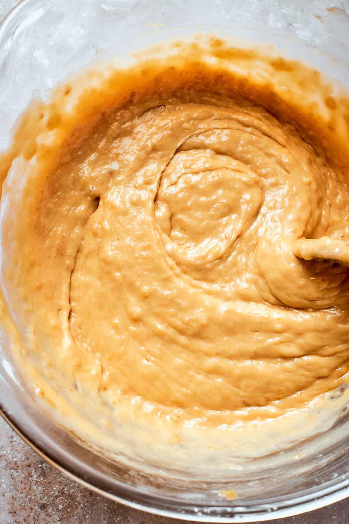 A thick batter for banana bread in a bowl.