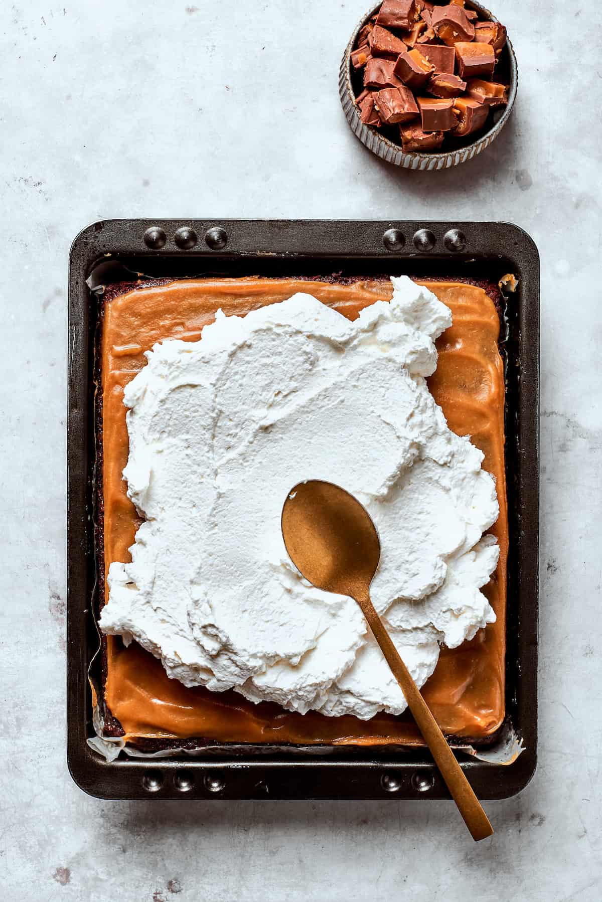 Cool Whip added to a caramel-topped chocolate cake.