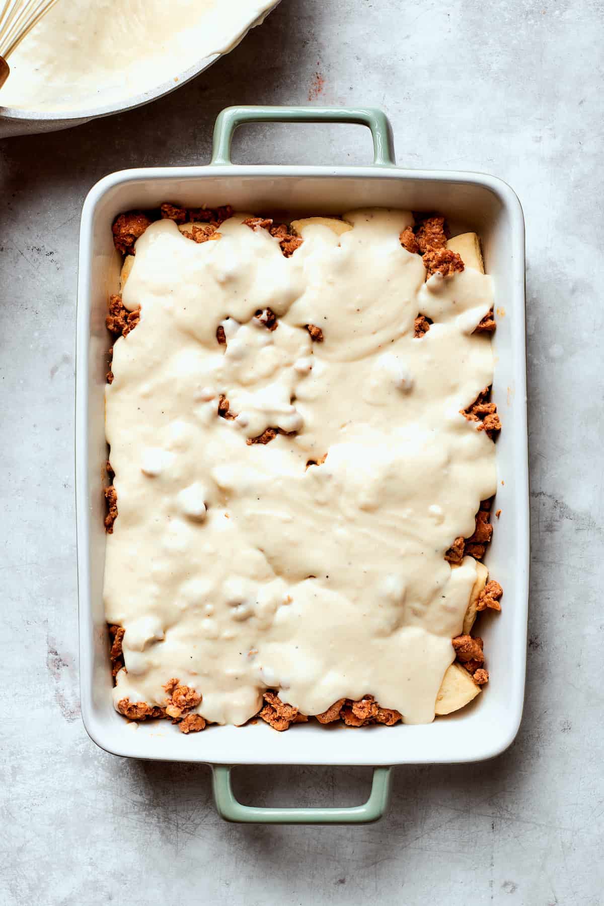 Gravy is added to biscuits and gravy casserole.