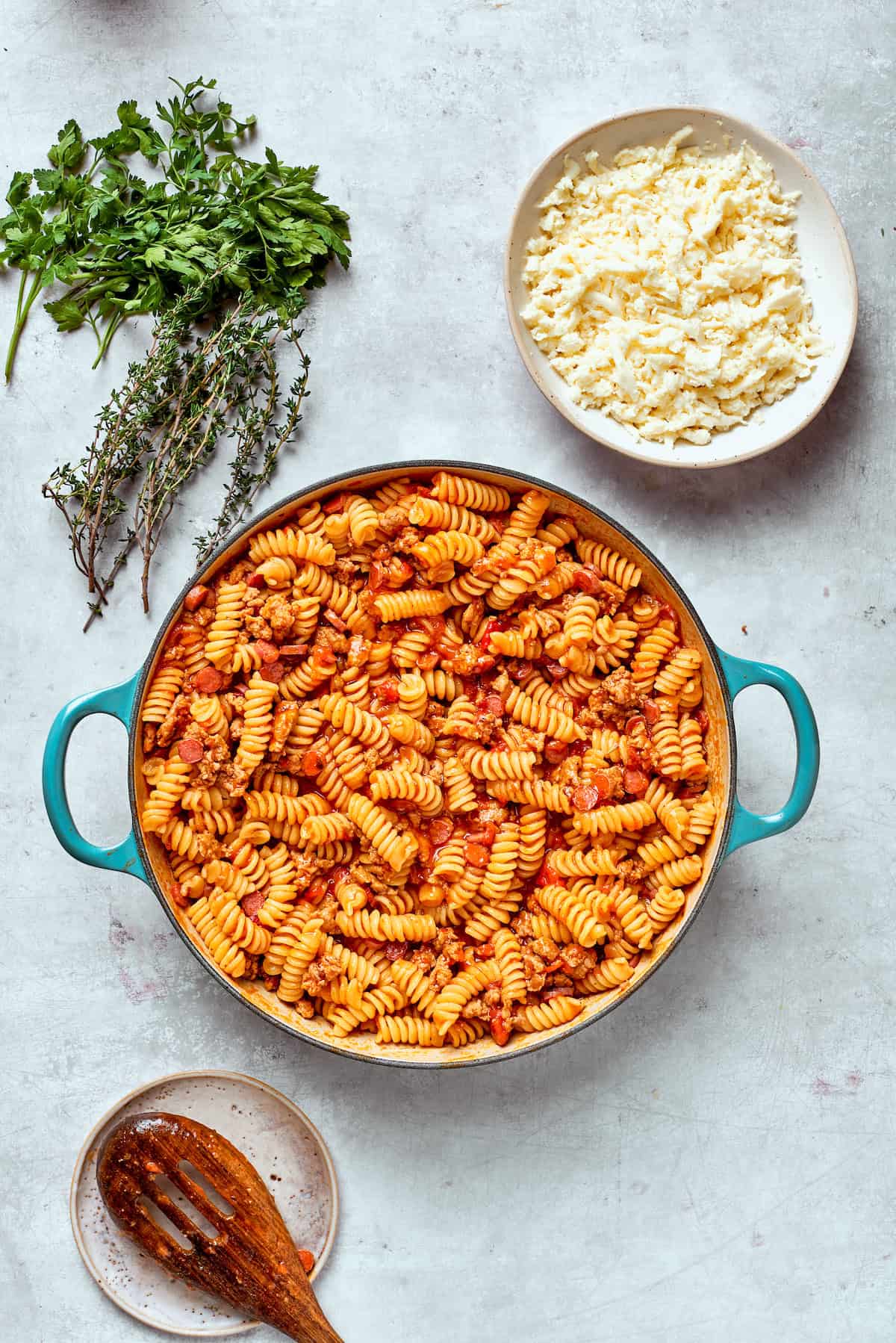 The pasta and sauce wait to be topped with cheese.