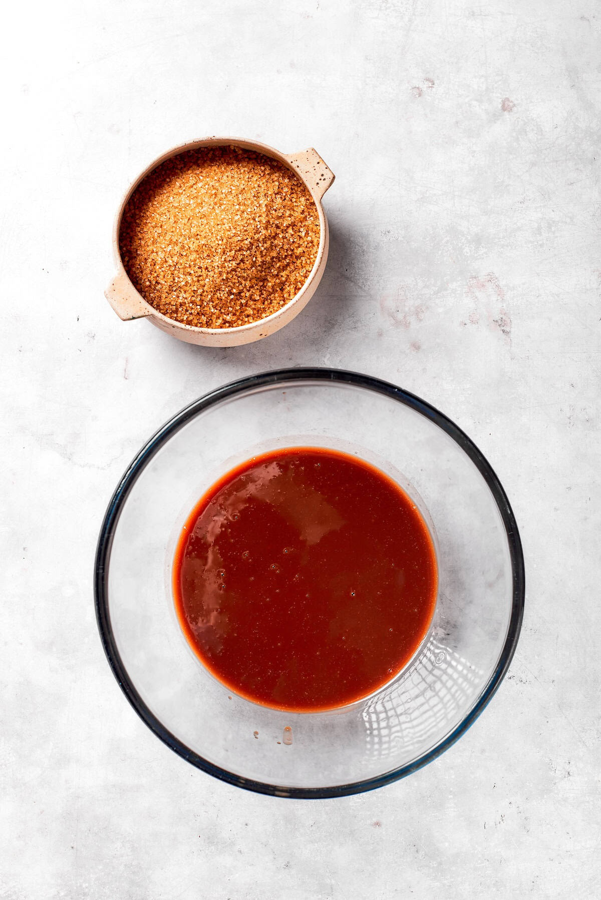 Oil and sugar mixed in a bowl.