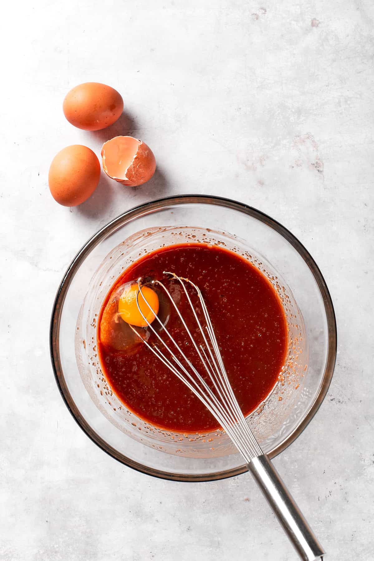 Eggs are whisked into browni batter.