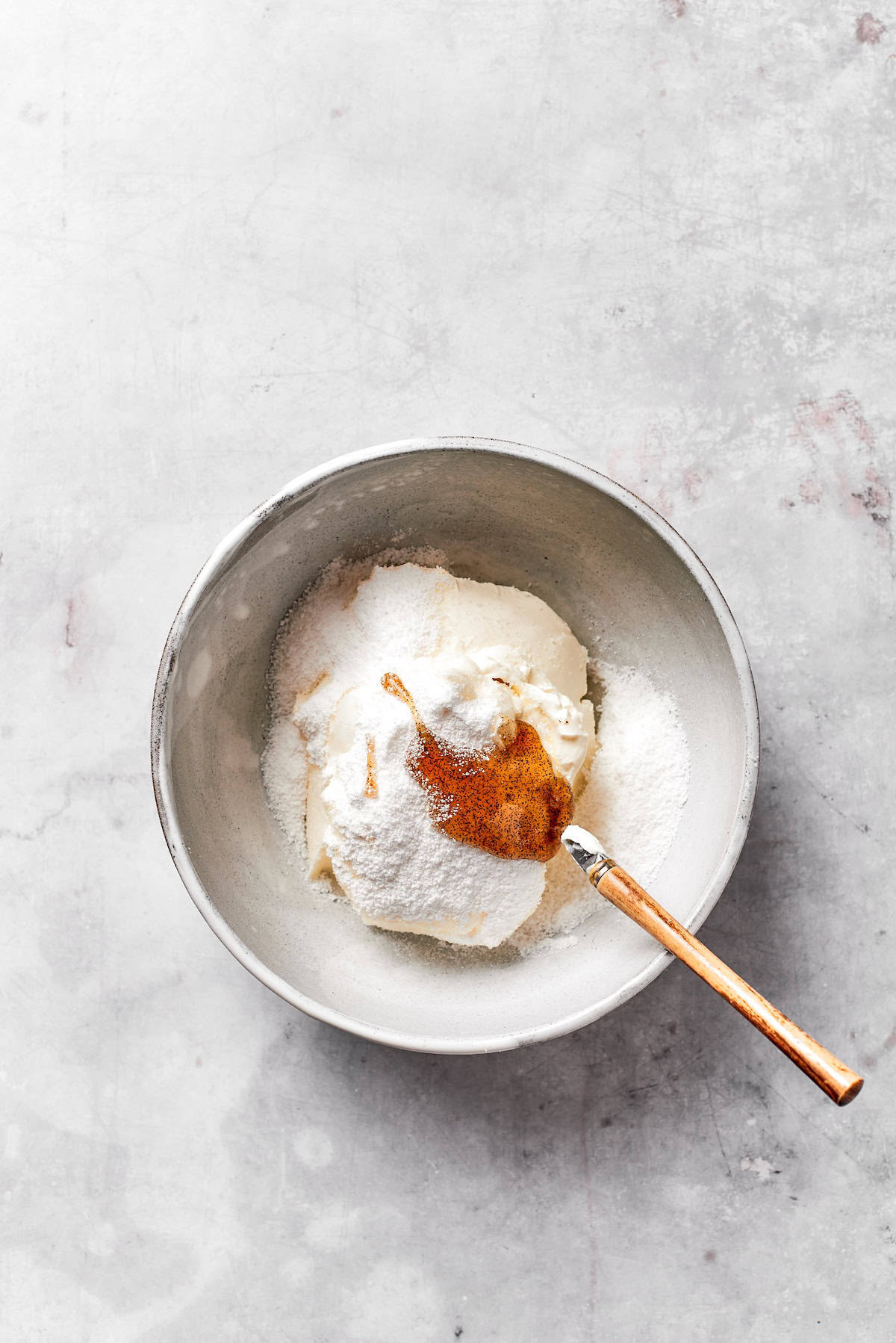 Cream cheese and butter creamed in a bowl.