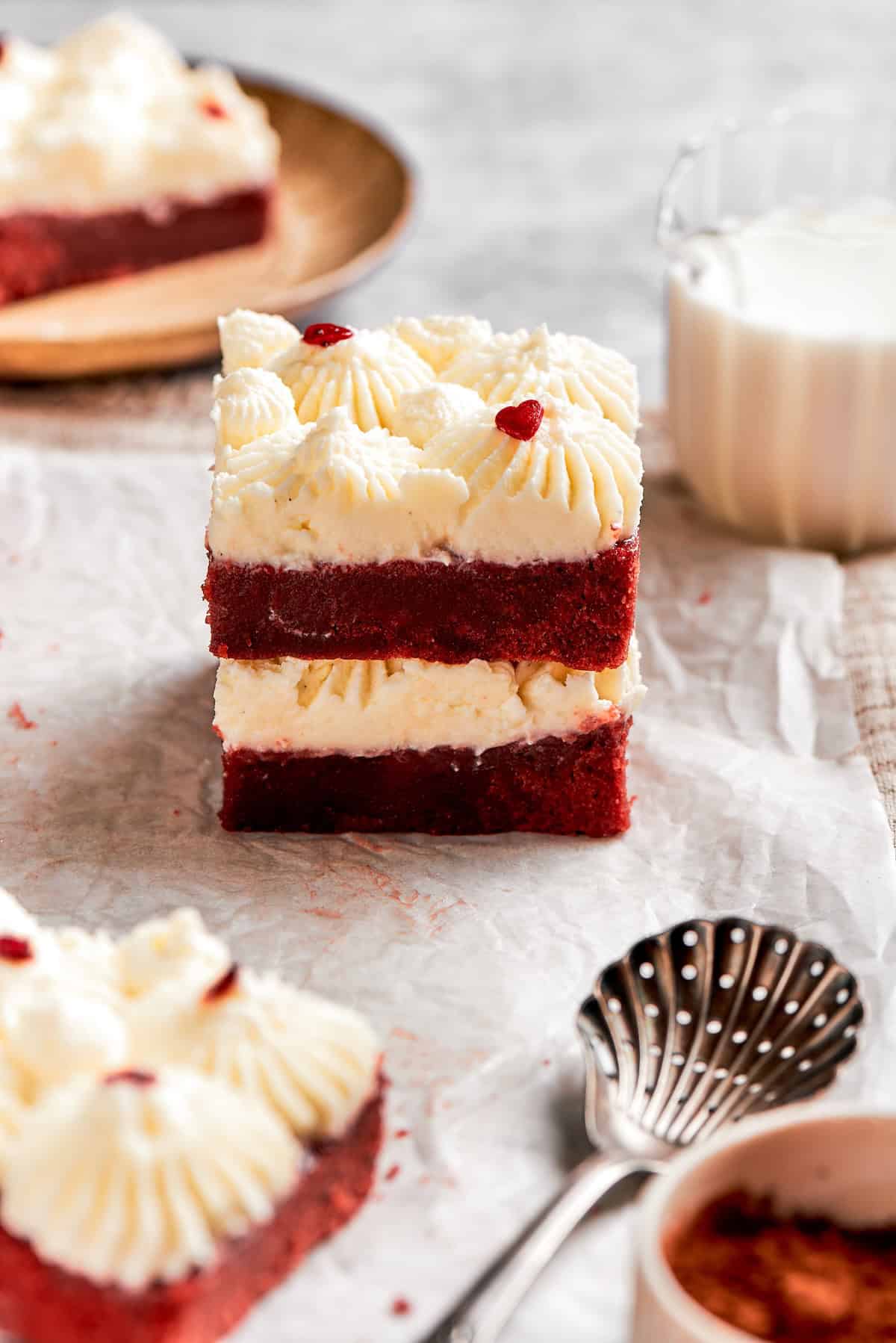 Two red velvet brownies stacked on top of each.