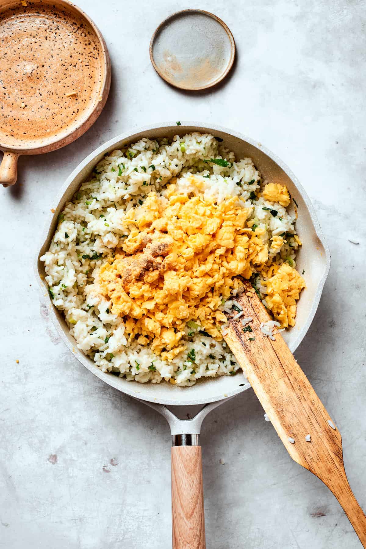 Scrambled eggs are added to rice.