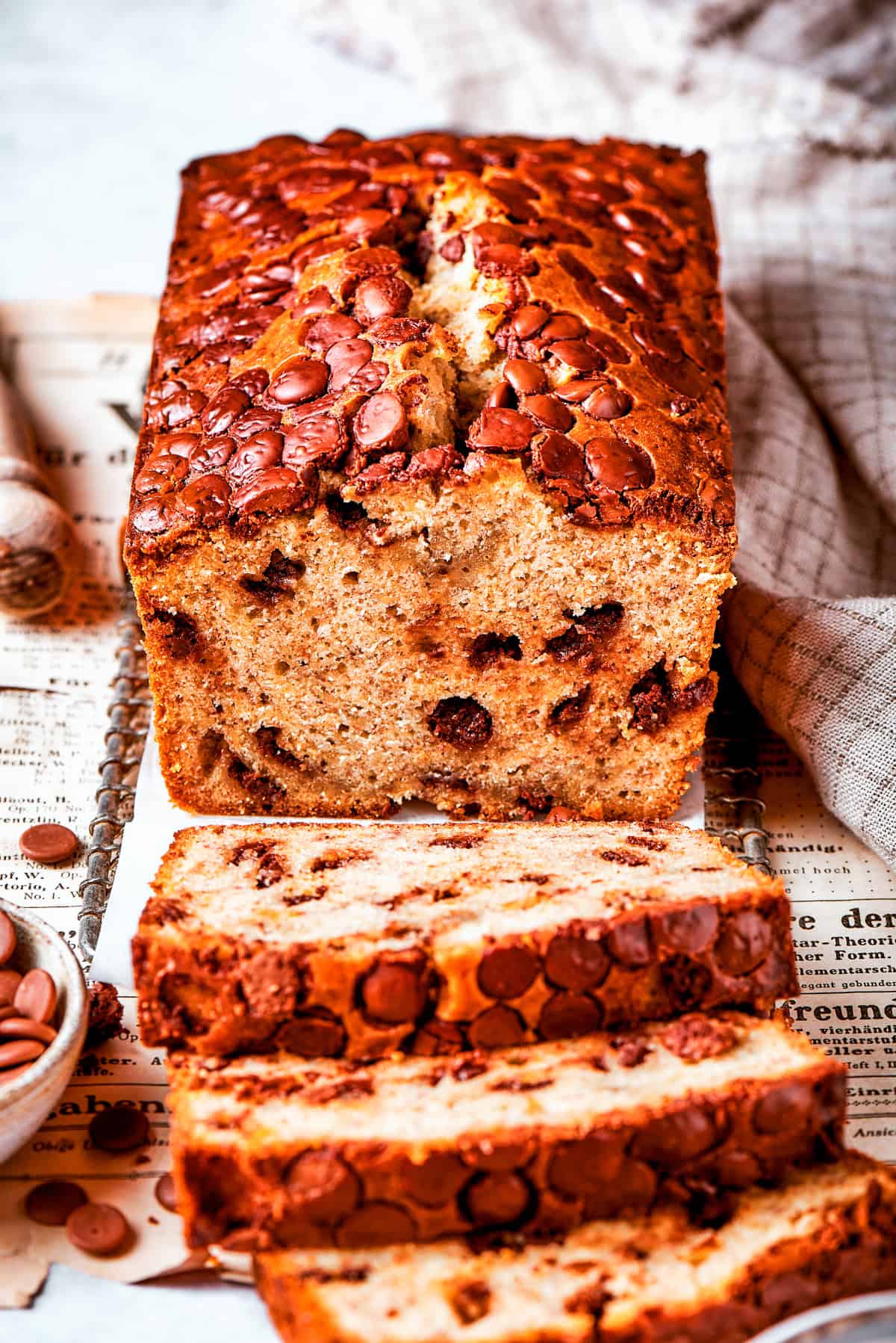 A loaf of banana chocolate chip bread cut into slices.