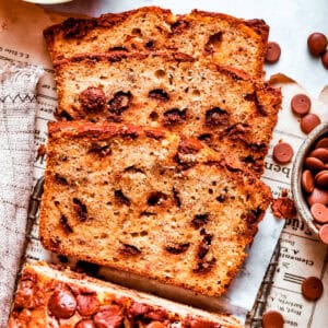 Sliced loaf of banana bread with chocolate chips.