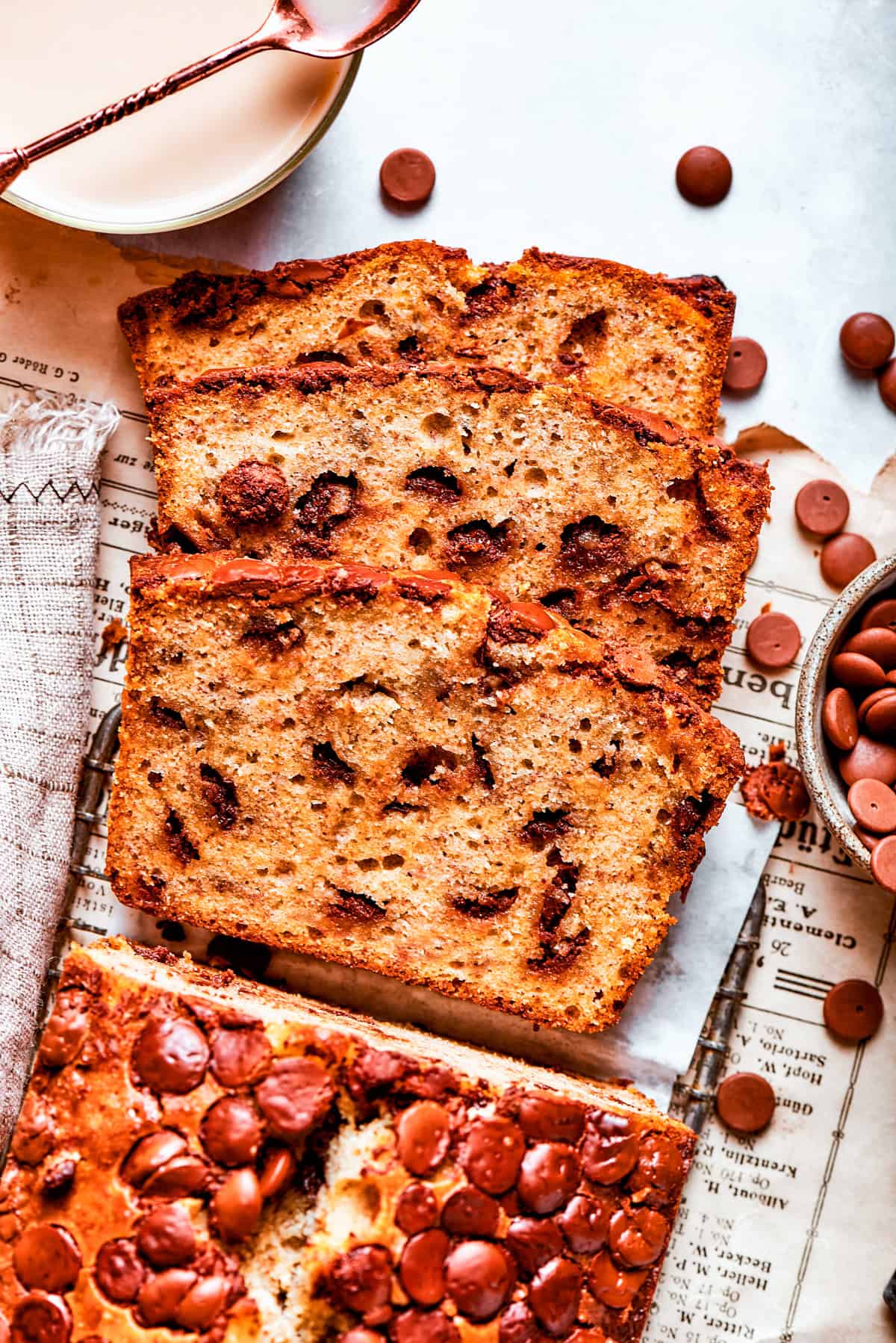 Sliced loaf of banana bread with chocolate chips.