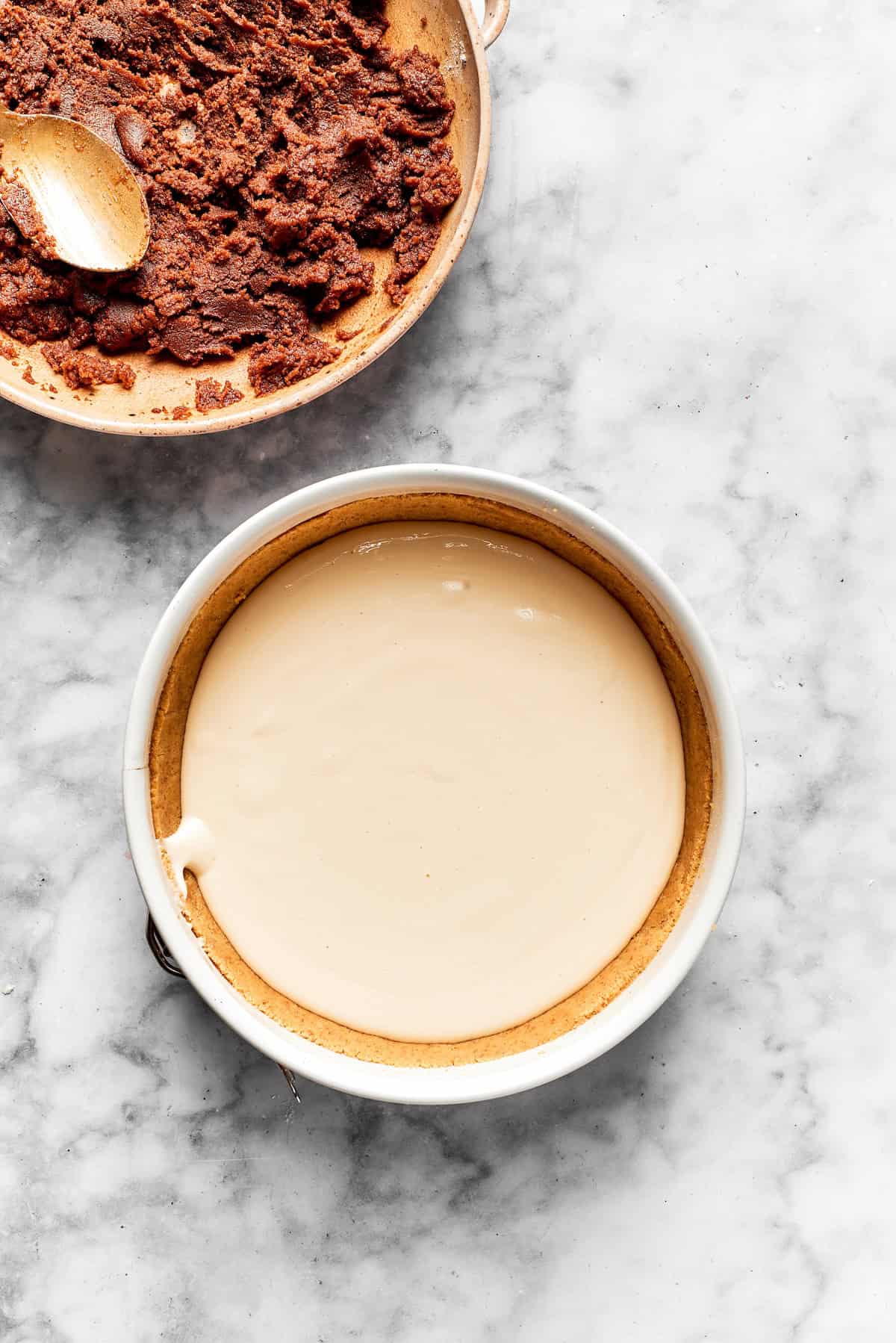 Cheesecake batter is added to a cookie crust.