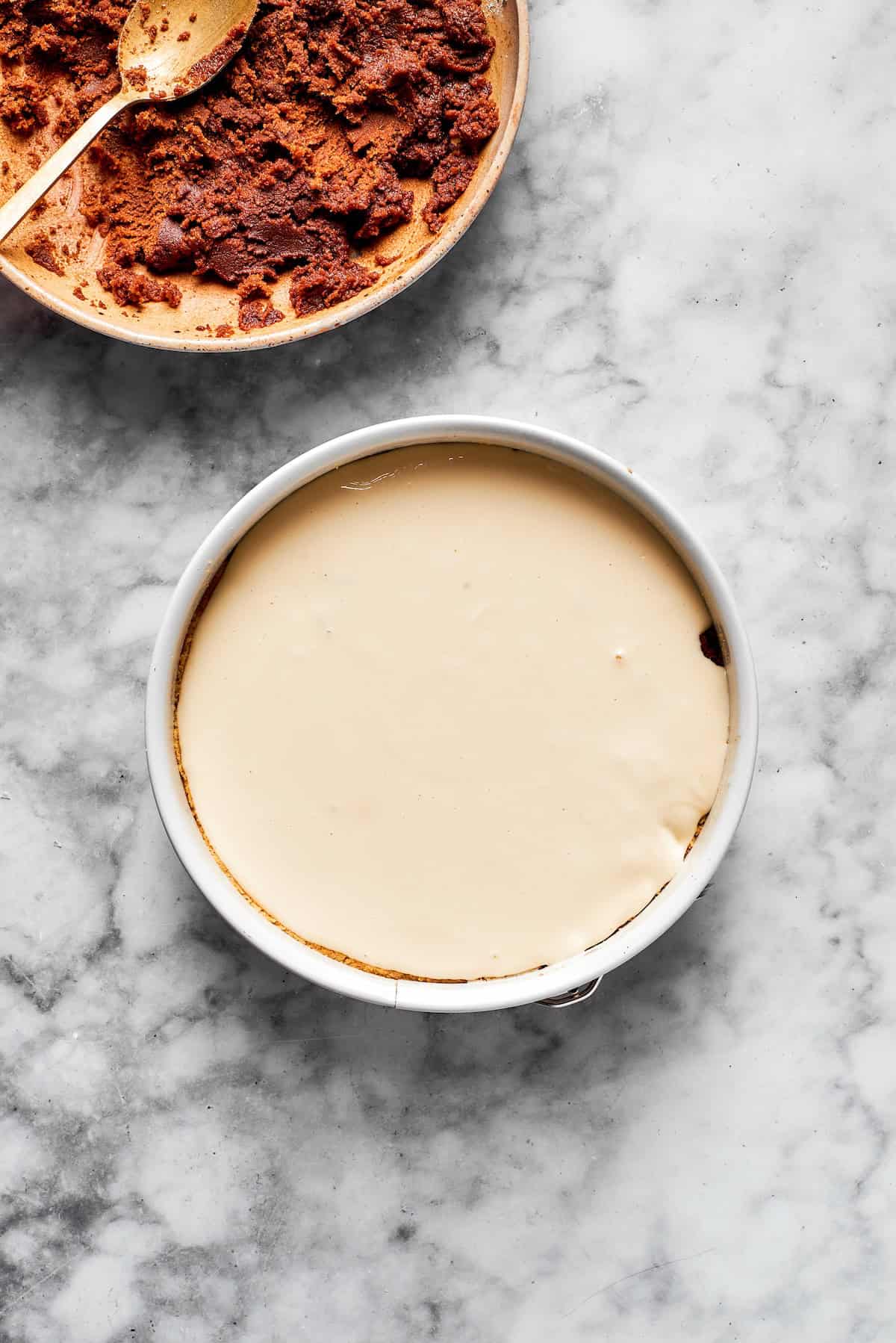 A cinnamon roll cheesecake before being baked.