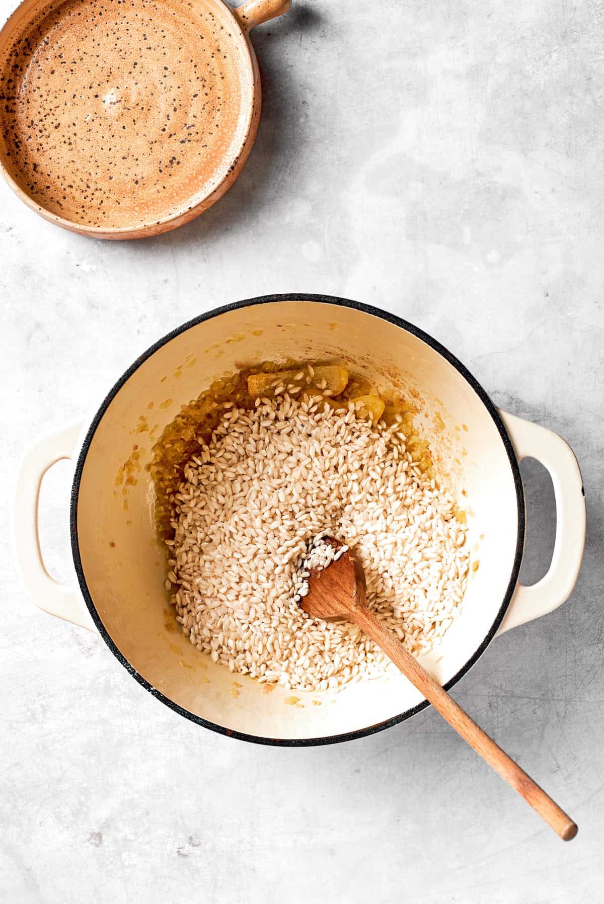 Rice is added to a pot.