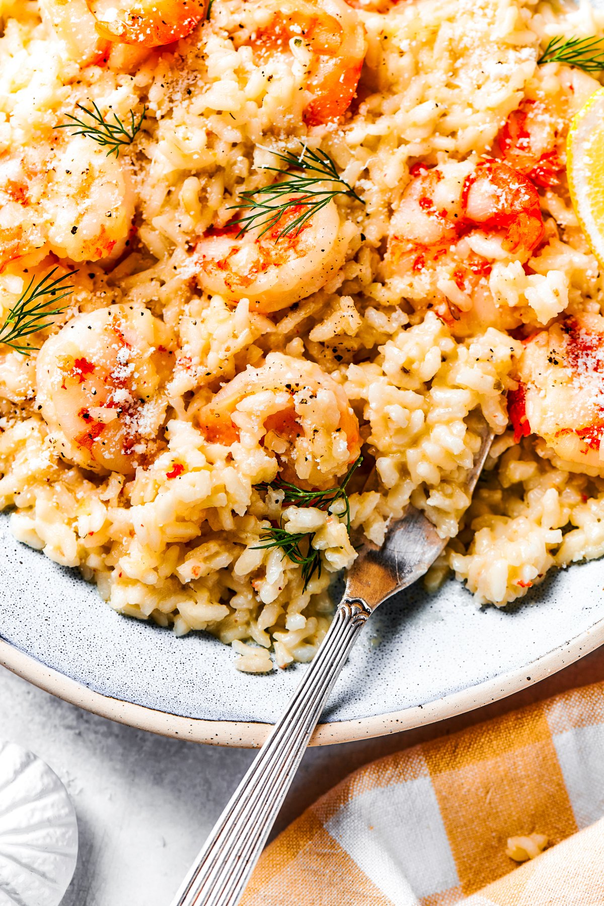 Rice and shrimp served on a dinner plate.