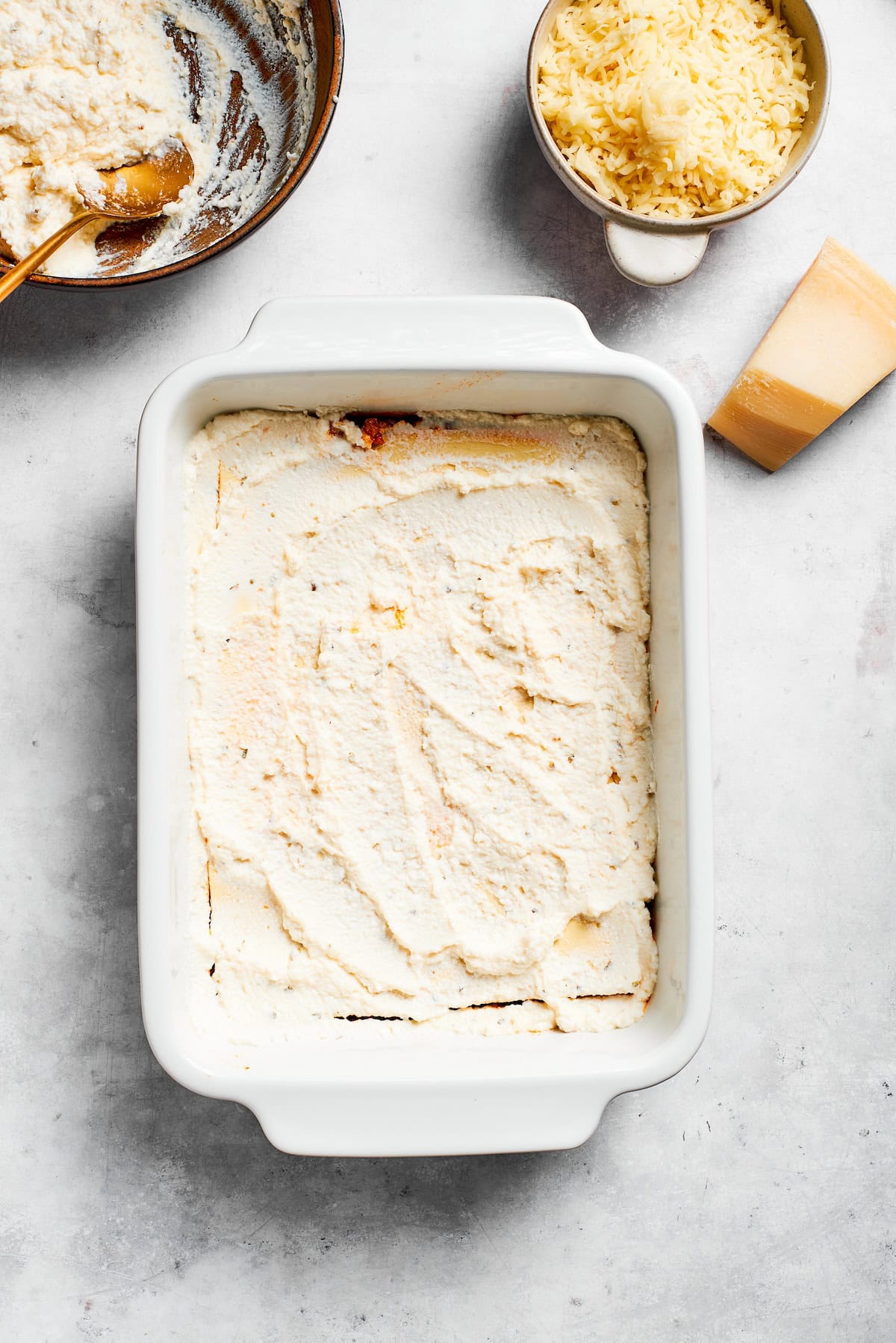Ricotta cheese tops pasta for lasagna.