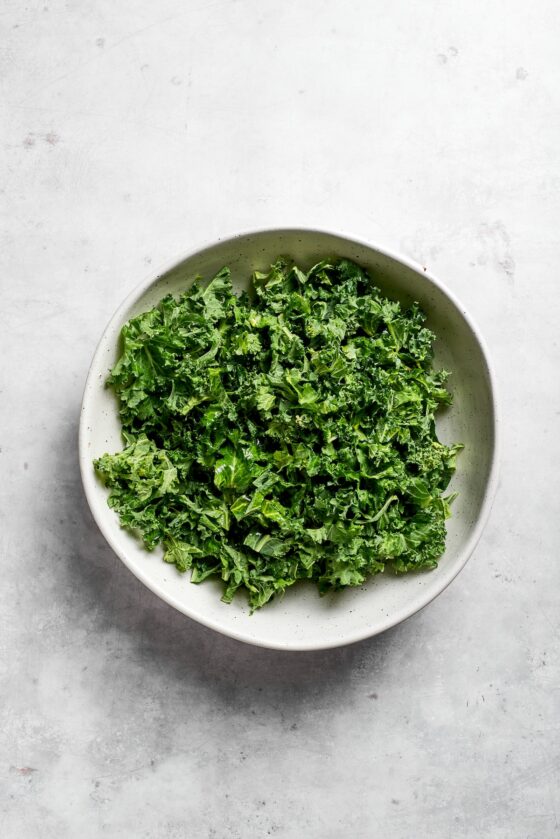 A bowl of kale leaves.