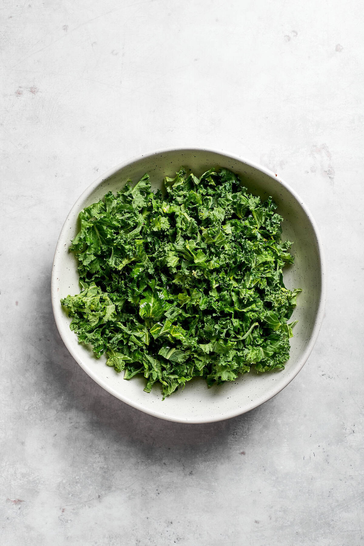 A bowl of kale leaves.