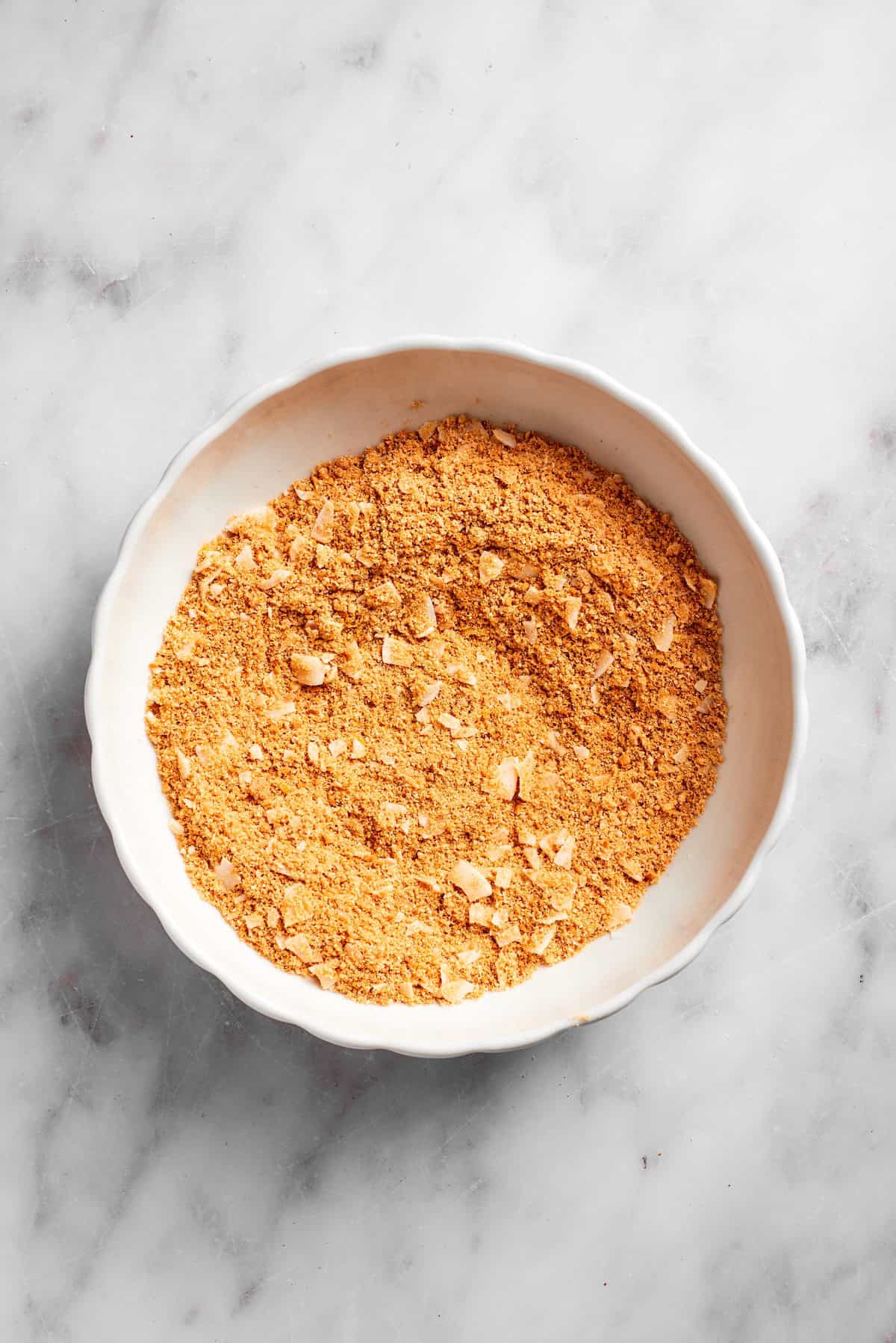 Graham cracker crust base in a bowl.
