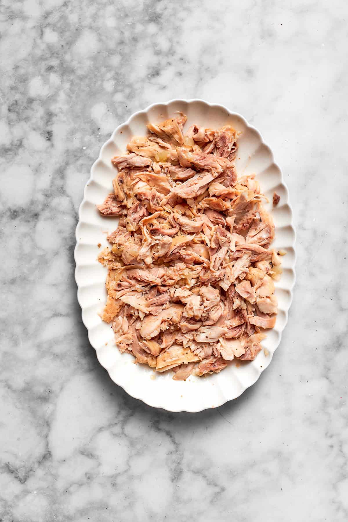 Shredded chicken on a platter.