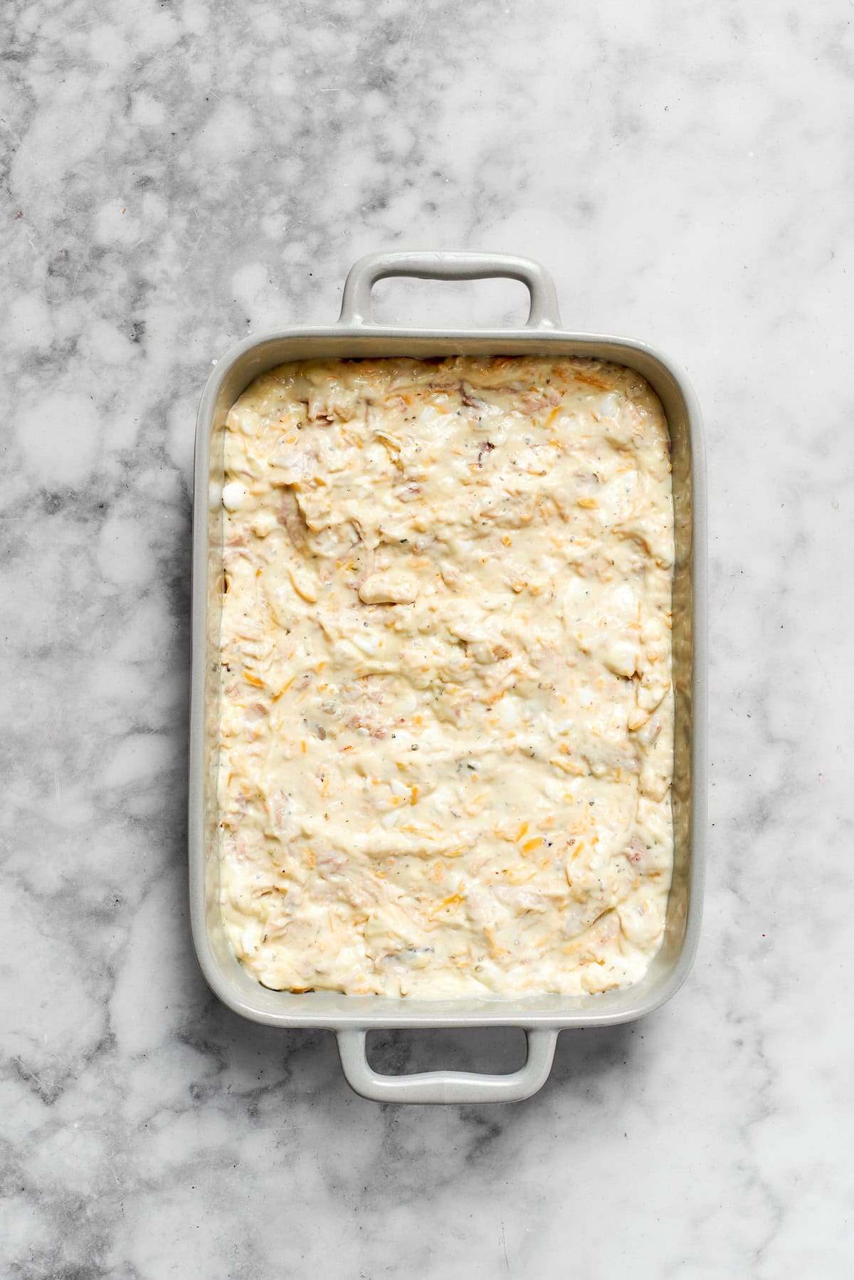 The casserole is added to a pan.