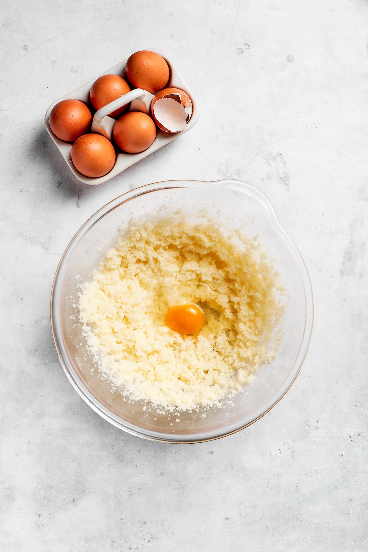 Eggs are added to creamed butter and sugar.