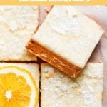 Frosted lemon bars with text overlay of the recipe's title.