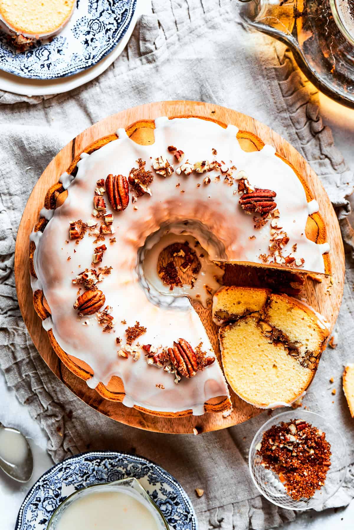 Overhead shot of a glazed sock it to me cake topped with pecans.